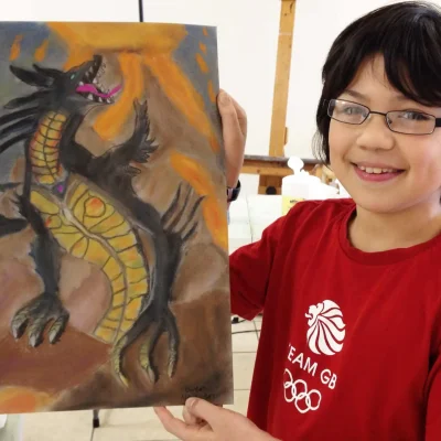 proud_12_years_old_with_a_pastel_on_paper_art_work