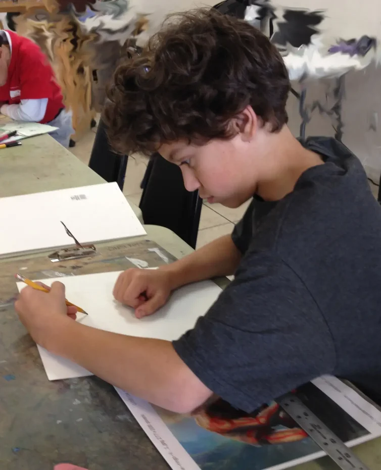 Luca_concentrating_on_sketching_drawing