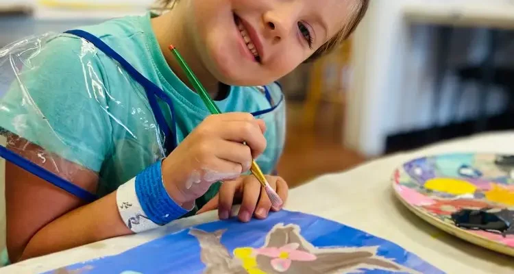 Age_6_yrs_old_student_having_fun_with_paint_project