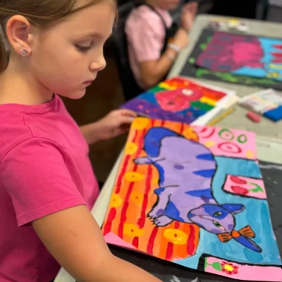 Final_touches_for_a_tempera_project_8_yrs_old_student