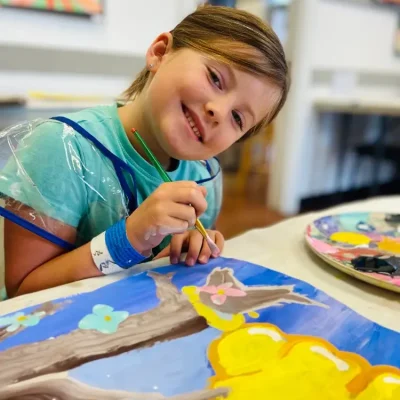 six_year-old_having_fun_in_art_class